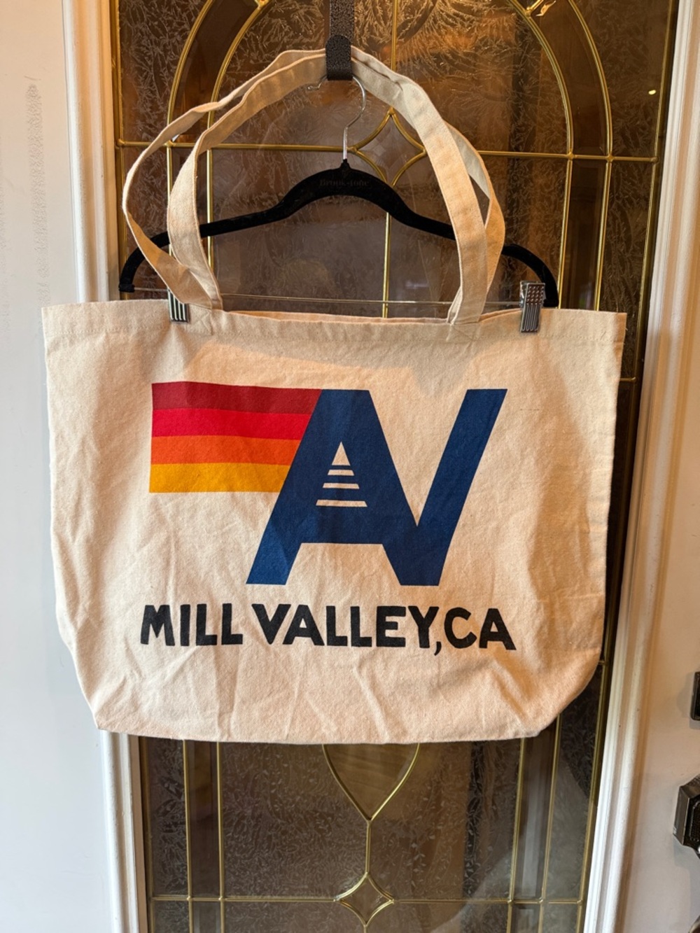 Aviator Nation Cream Canvas Tote with Navy Logo and Red-Orange-Yellow Stripes